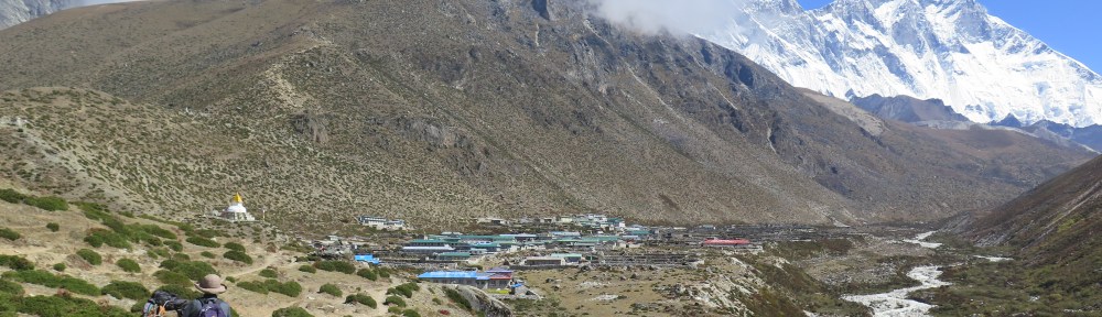 Walking into Dingboche with the river below.