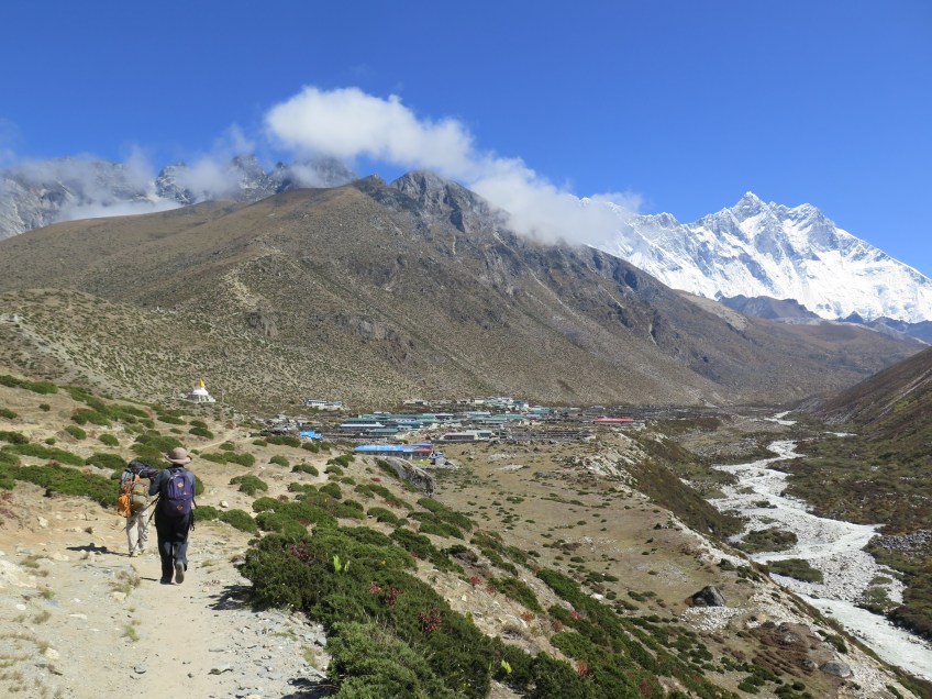 Walking into Dingboche with the river below.