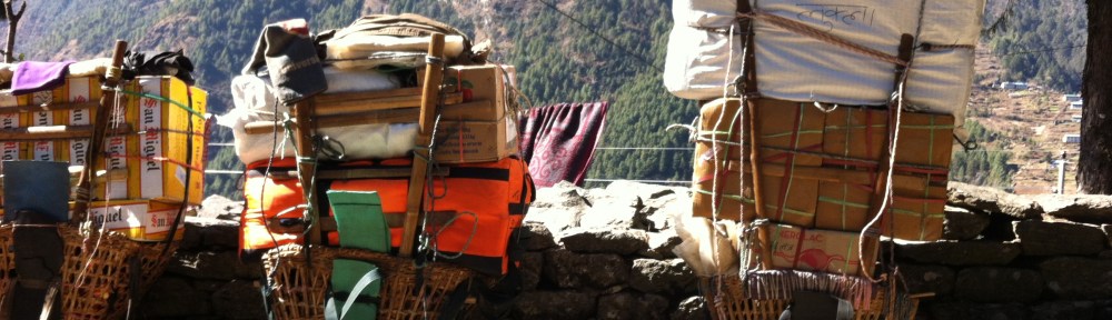 Porters loads at a resting point on the EBC Trek