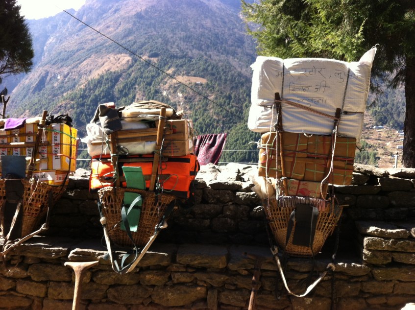 Porters loads at a resting point on the EBC Trek