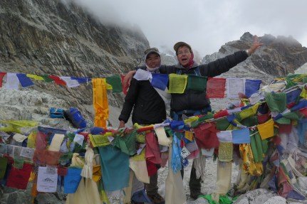 Trekker and Porter Guide on top of Cho La Pass Nepal