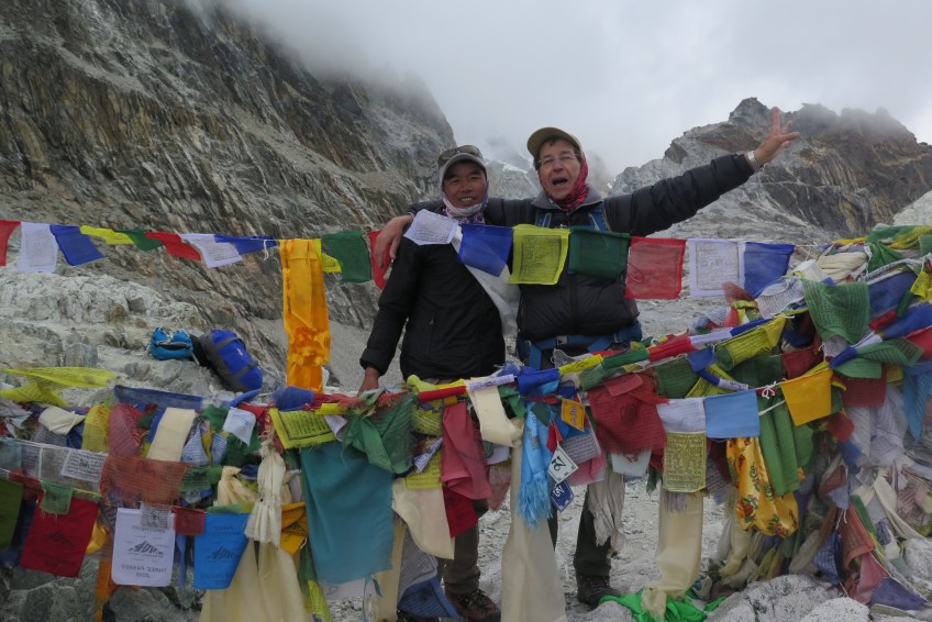 Trekker and Porter Guide on top of Cho La Pass Nepal
