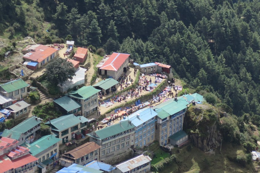 setting up for the weekly market in namche bazaar from above